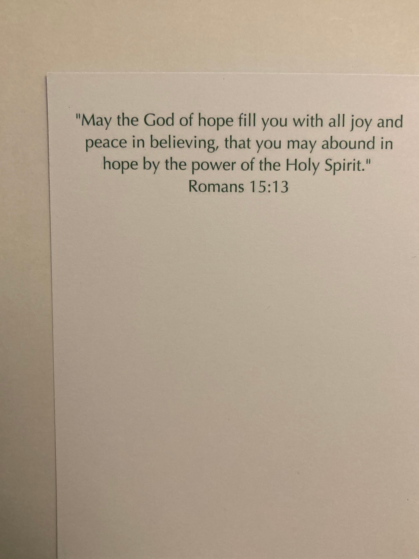 Note with a biblical quote on a plain background